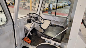 Tug MA50 Inside View of Driver's Side with Deadman's Switch on Floor. Heater box in backround.